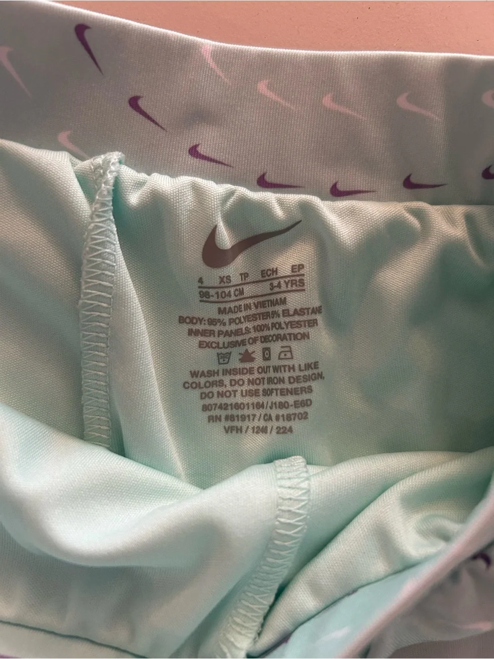 Nike Girls' Mint Green Athletic Skort with Purple Swoosh Accents